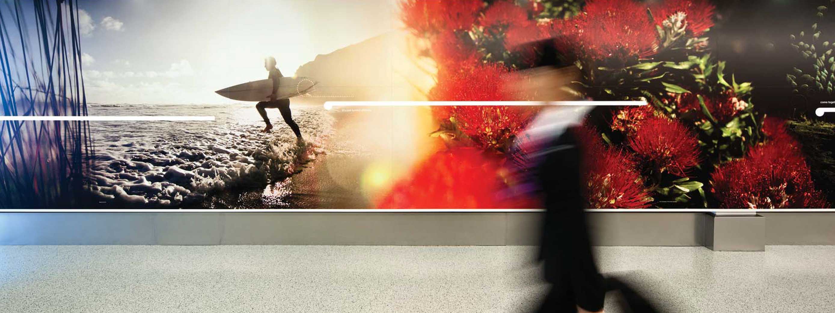 Floor to ceiling photos of New Zealand scenery as your arrive at Auckland international airport