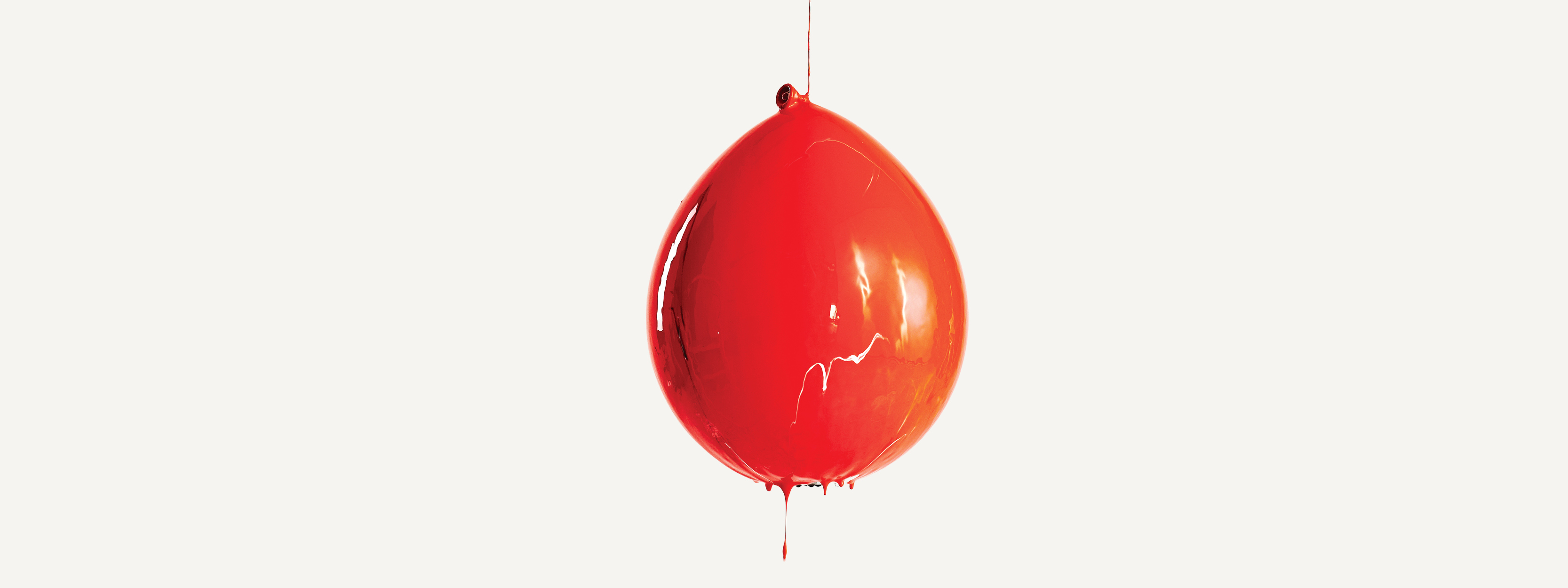 A balloon covered in red paint