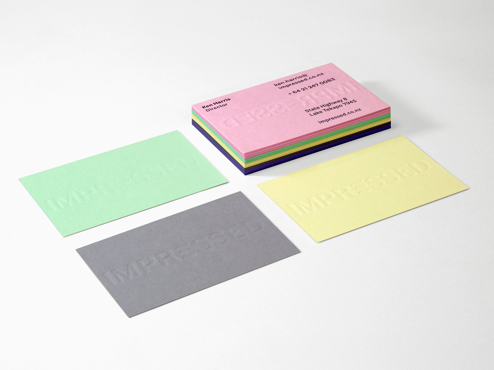 Impressed embossed business cards in the brands colours